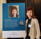 Author in front of placard